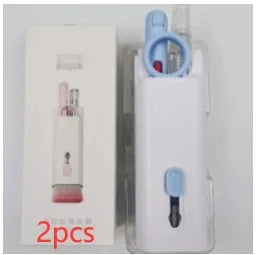 White multifunctional electronic cleaning kit with foldable pen, retractable brush, keycap puller, and spray bottle.