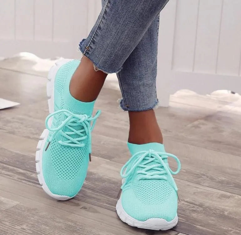 Women's high-cut lace-up platform sneaker in a choice of seven colours on a rubber sole.