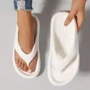 Women's black thick-soled EVA flip-flops with non-slip tread in a paired size format