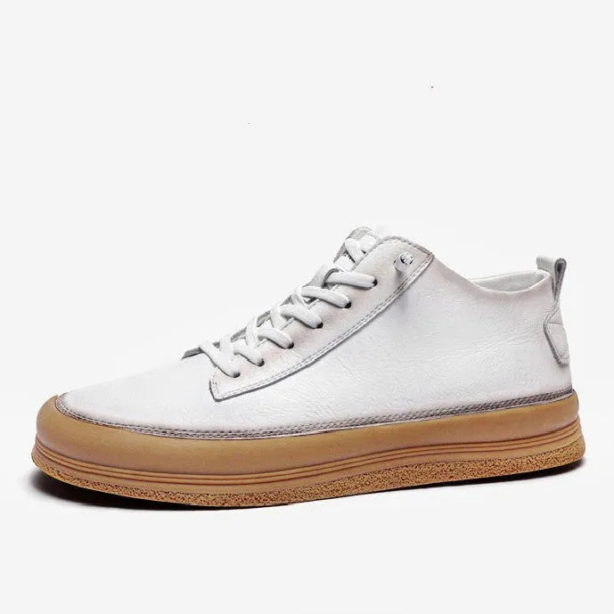 Men's black leather casual shoes with round toe and white flat rubber sole on a plain background
