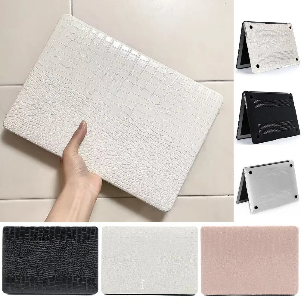 Black MacBook protective case with crocodile texture and visible Apple logo through a cutout.
