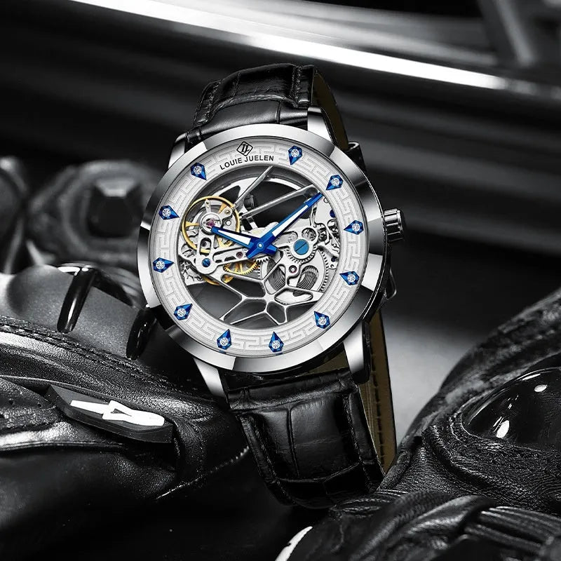 Men's silver case mechanical watch with white dial, blue hands, black leather strap, and luminous markings