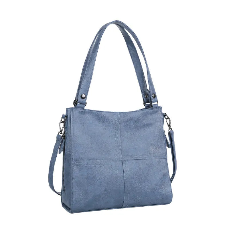 Barrel-shaped crossbody handbag in soft PU leather measuring 30 by 31.5 centimetres