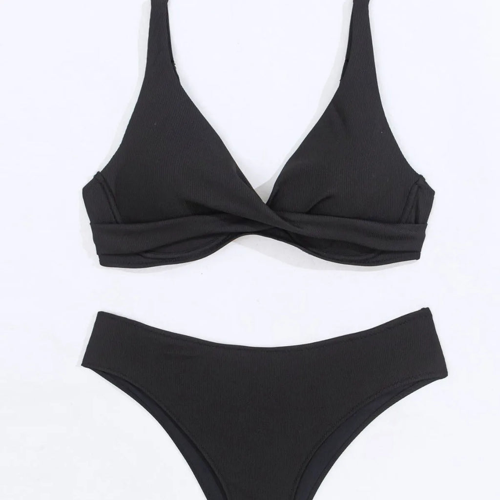 Women's solid colour rib fabric bikini set in black, green, or blue.