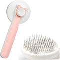 Blue self-cleaning cat brush with rubber-tipped metal pins and ergonomic handle for pet grooming