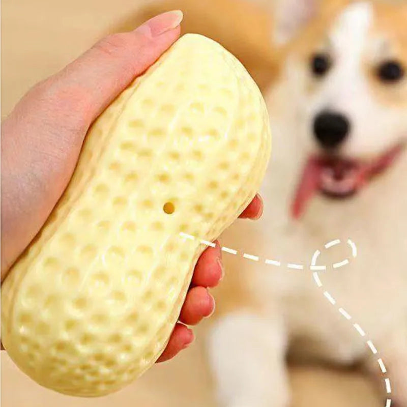 Yellow peanut-shaped dog chew toy with textured surface for teeth cleaning