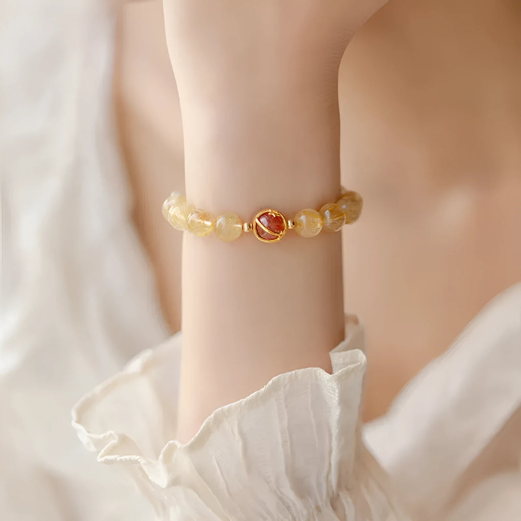Gold rutilated quartz crystal bracelet with diamond cut stones in unisex Korean style design