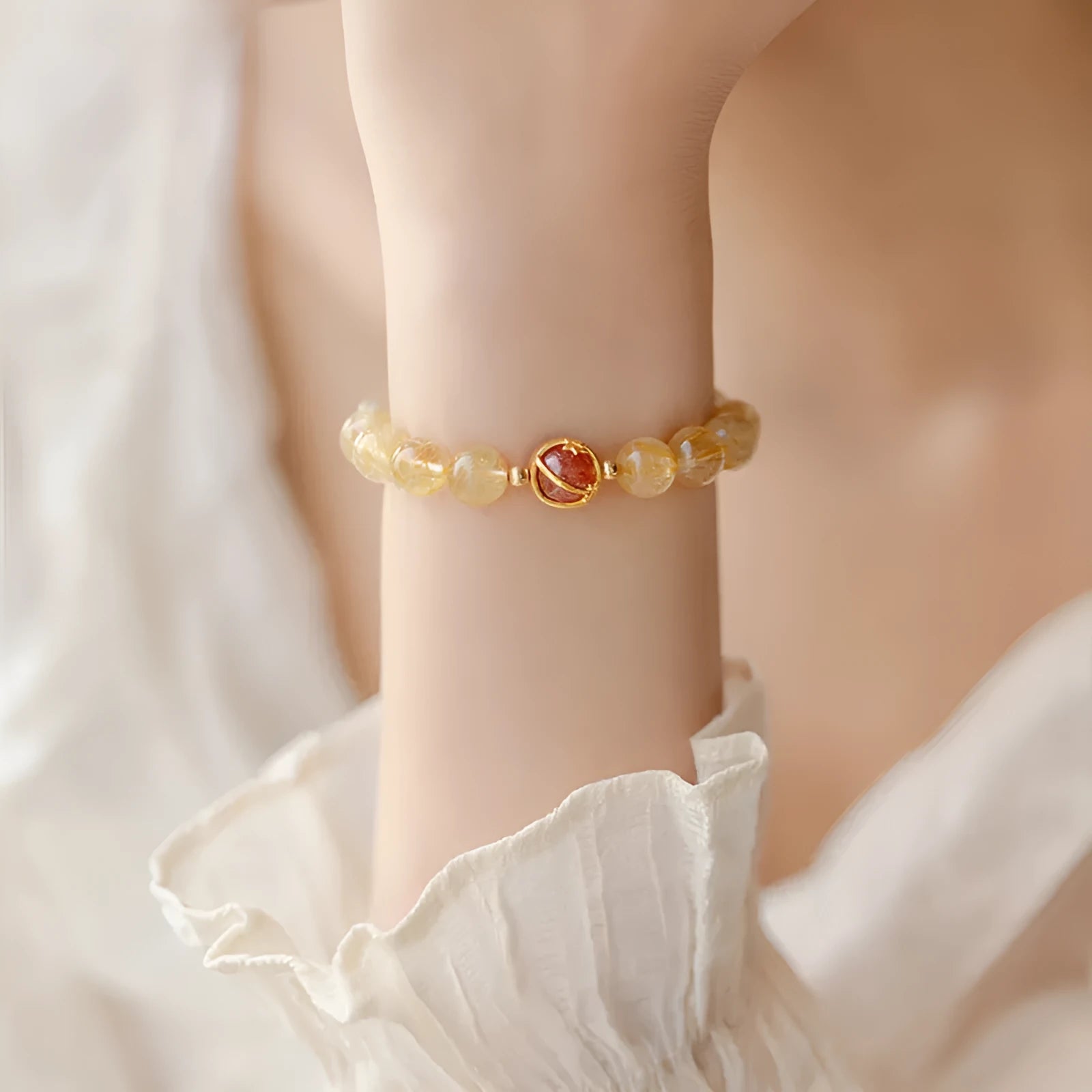 Gold rutilated quartz crystal bracelet with diamond cut stones in unisex Korean style design