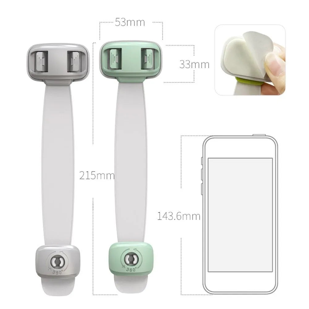 Grey adjustable child safety strap lock with adhesive pads, shown securing a kitchen cabinet door.