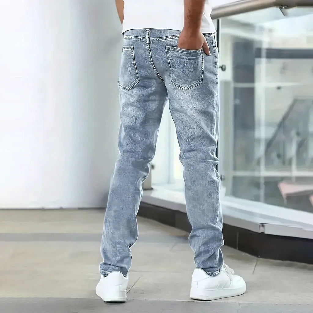Men's black stretch skinny jeans showing high elasticity cotton-spandex fabric with zipper fly and straight leg cut