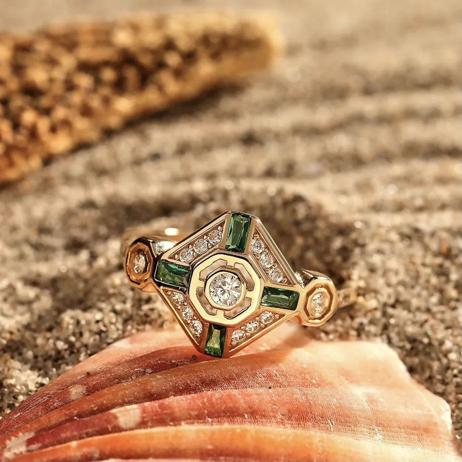 Square-cut emerald green gemstone ring on a finger, showing geometric ins-style design.