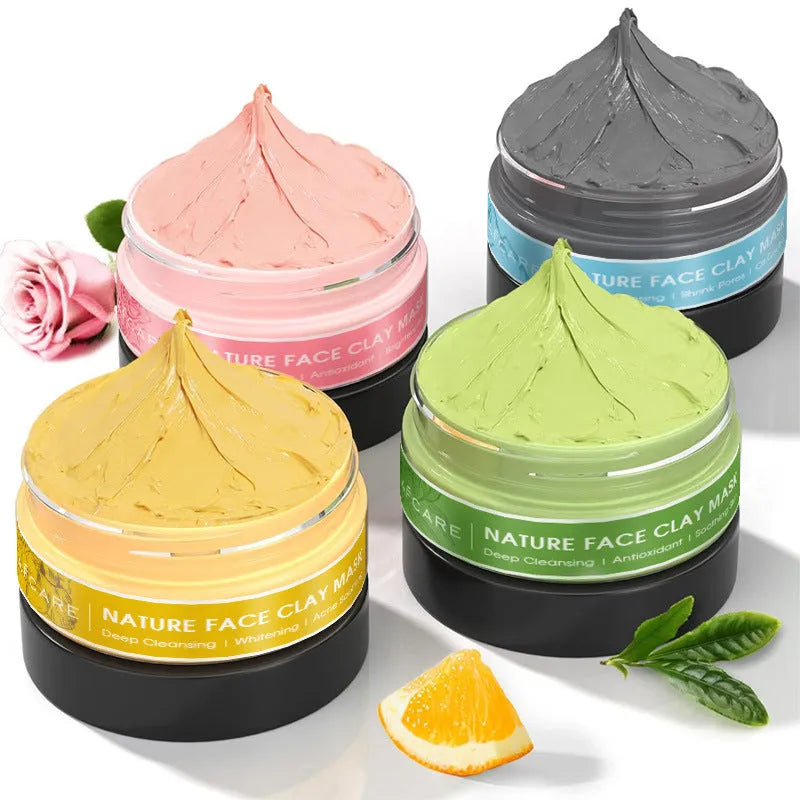 Four jars of clay facial masks: Dead Sea mud, green tea, turmeric, and rose clay in an 80ml 4-pack set.