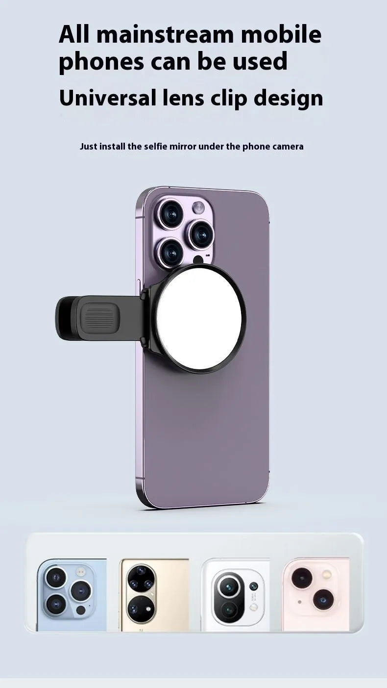 Black mobile phone rear camera self-timer mirror clip with plastic and glass construction, shown attached to a phone.