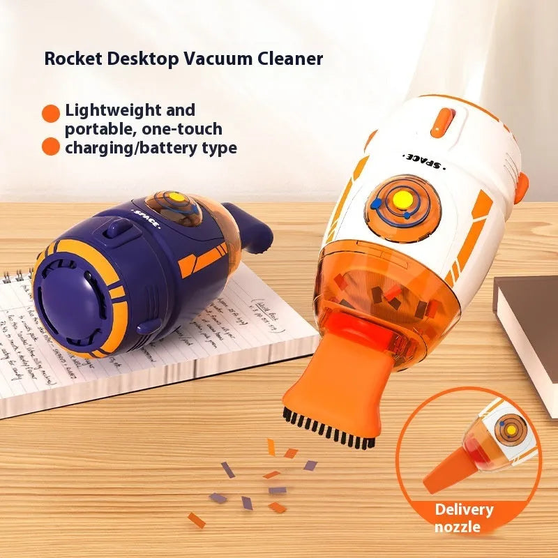 Blue handheld USB desktop vacuum cleaner on a wooden desk next to a keyboard.