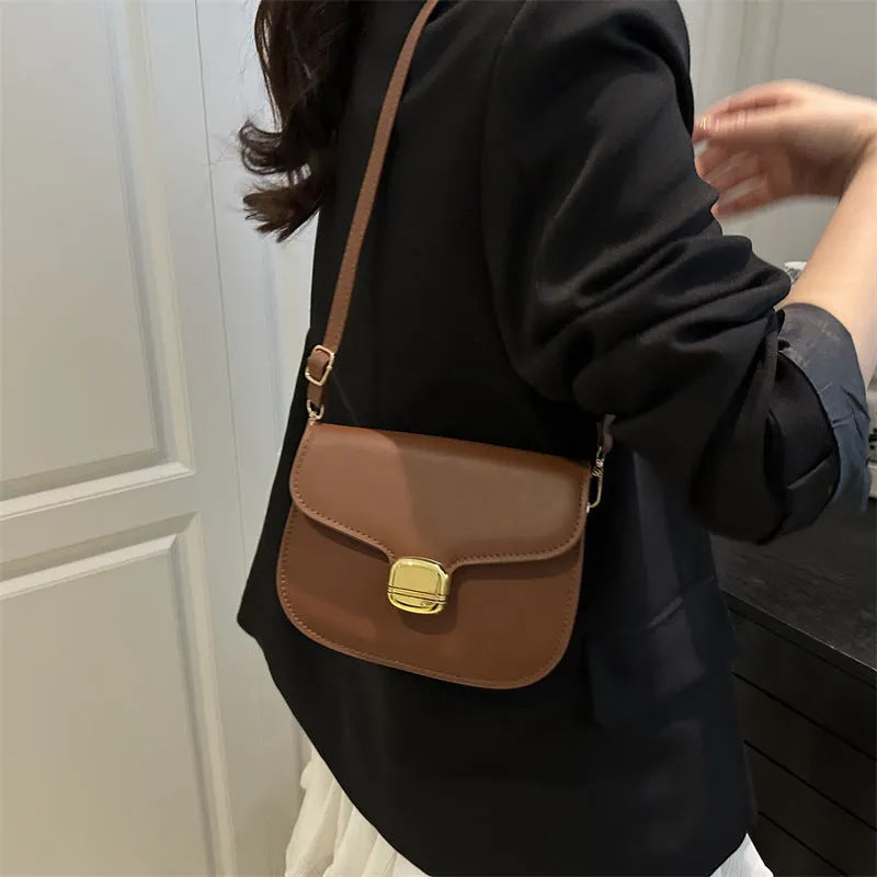 Simple PU women's handbag in khaki colour with internal phone and change pockets.