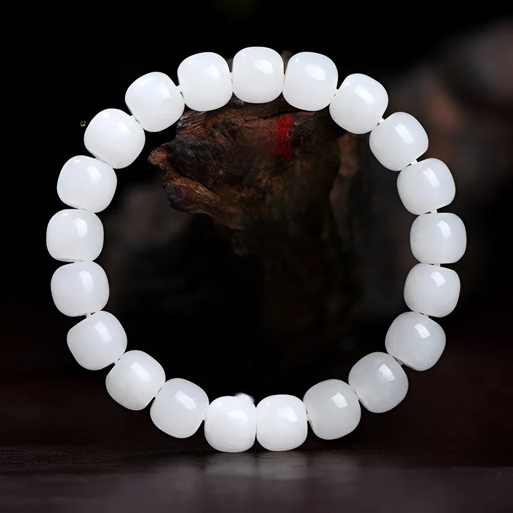 White Hetian jade barrel bead bracelet for men and women showing polished beads.