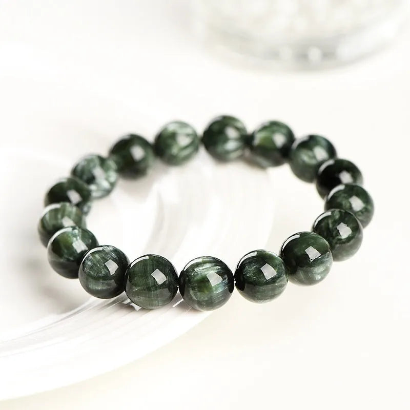 Green Dragon Crystal bracelet with 8-9mm round beads and Ruyi design element.