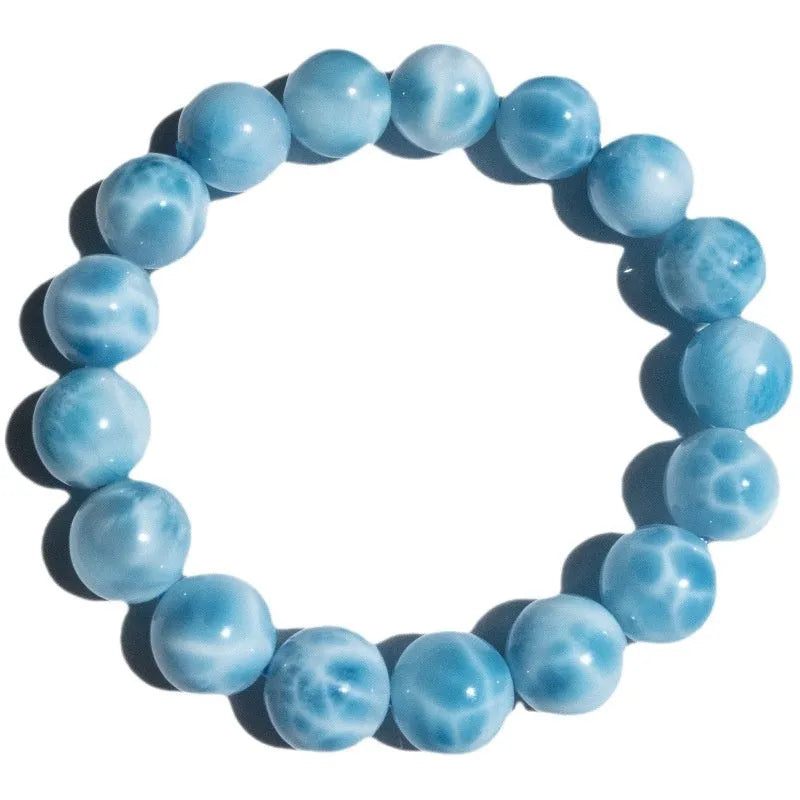 Blue bodhi bracelet with natural crystal sea-pattern stone centrepiece and pearl details in Maillard style