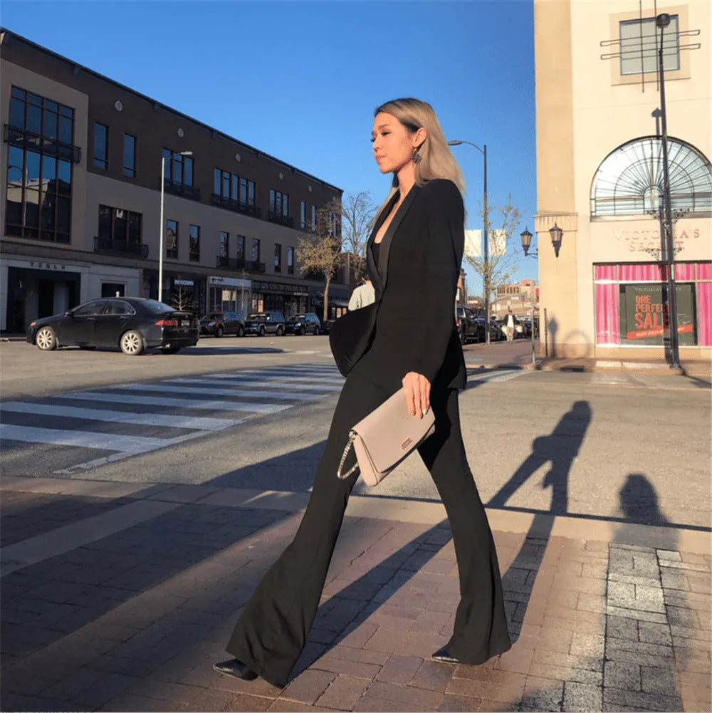High waist black flared pants for ladies made from cotton blend fabric, available in multiple sizes