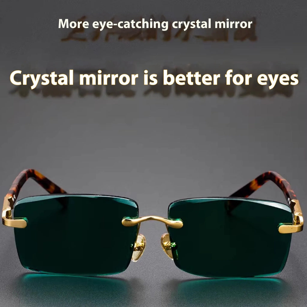 Frameless sunglasses with dark green crystal lenses showing a decorative wealth attracting pattern.