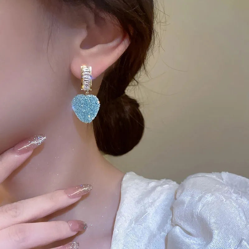 Blue and pink candy-style heart-shaped alloy stud earrings for women on a white background.