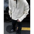 Women's solid colour loose long sleeve pullover top in grey, black, or apricot with letter pattern.