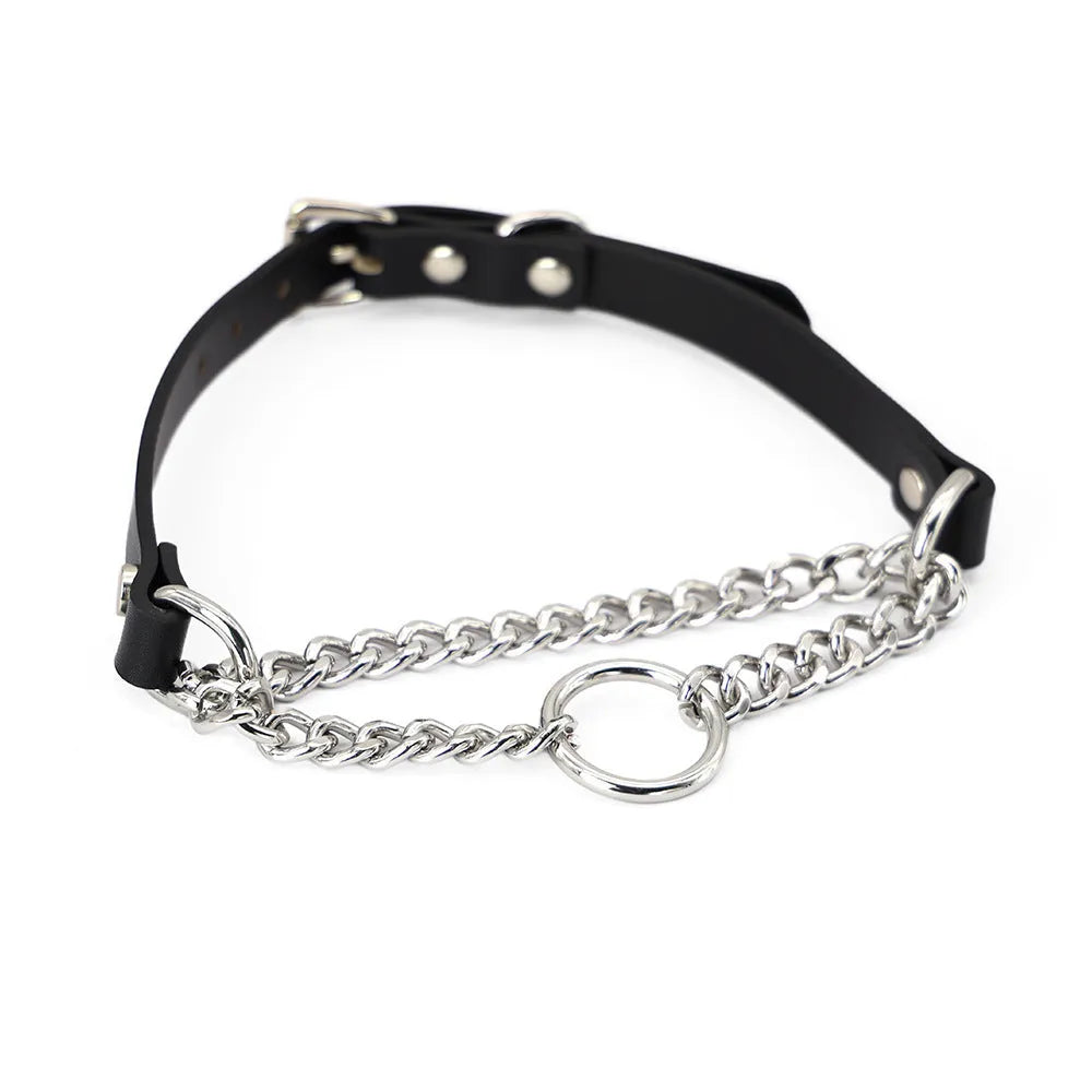 Black leather dog collar with chain tightening mechanism and matching leash on dark background