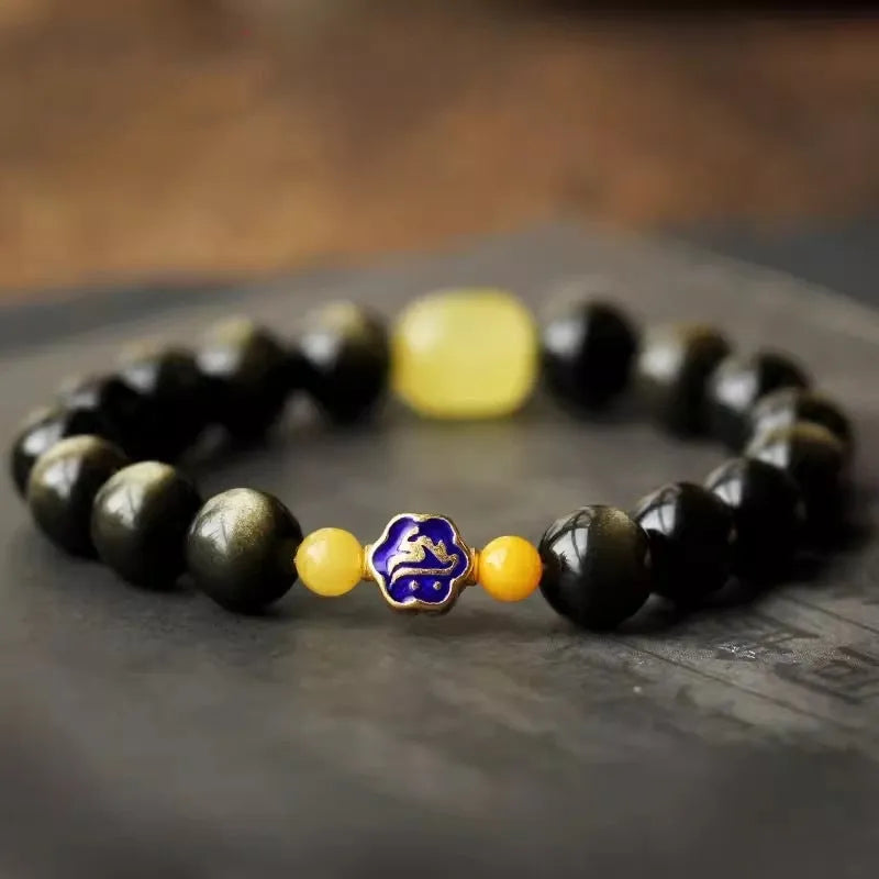 Natural golden obsidian bracelet with geometric zodiac charm bead showing chicken zodiac design