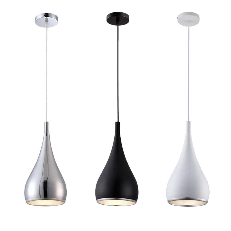 Modern minimalist iron chandelier with three light heads in a black finish, suspended from the ceiling.