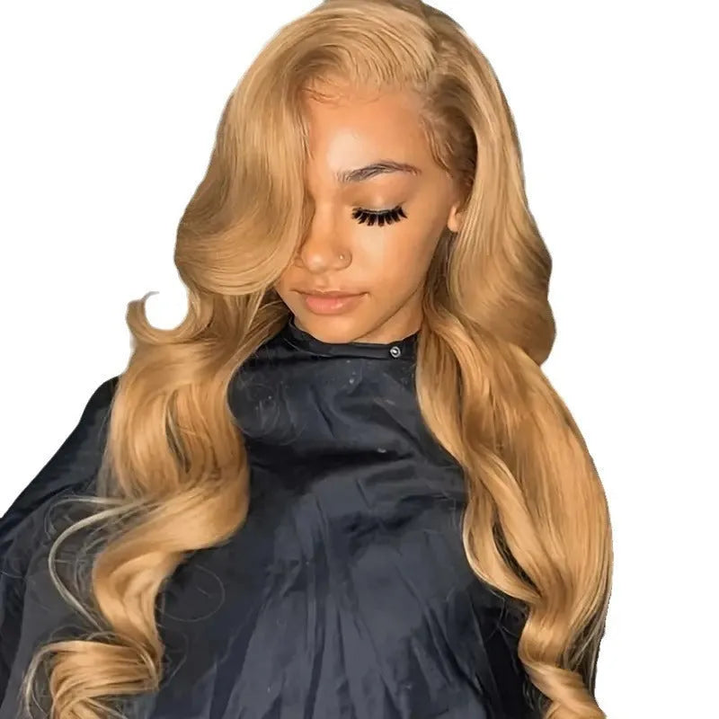 Light brown synthetic wig with long golden big waves, side bangs, and heat-friendly high temperature fibre.