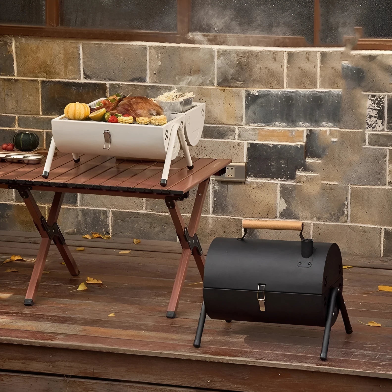 White portable folding charcoal grill with detachable oven net and carbon tank.
