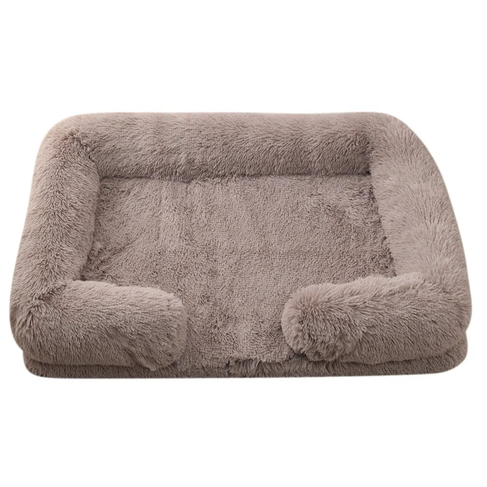 Plush round dog bed with raised edges in a solid colour, shown with a built-in inner sleeve.