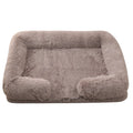 Plush round dog bed with raised edges in a solid colour, shown with a built-in inner sleeve.