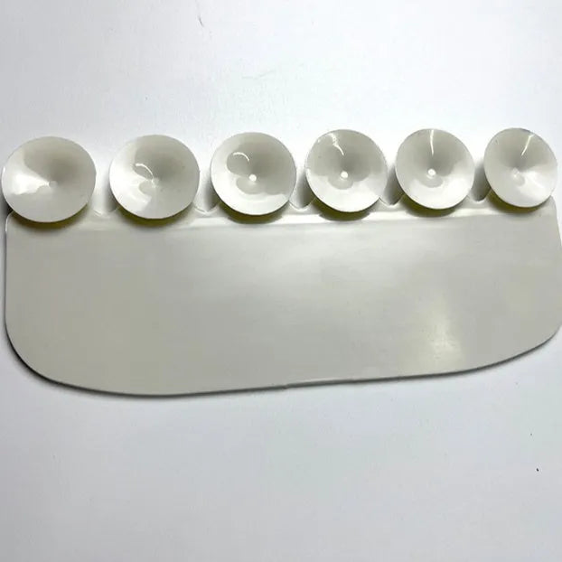 White PVC toilet urine blocking board for children's training placed on toilet rim