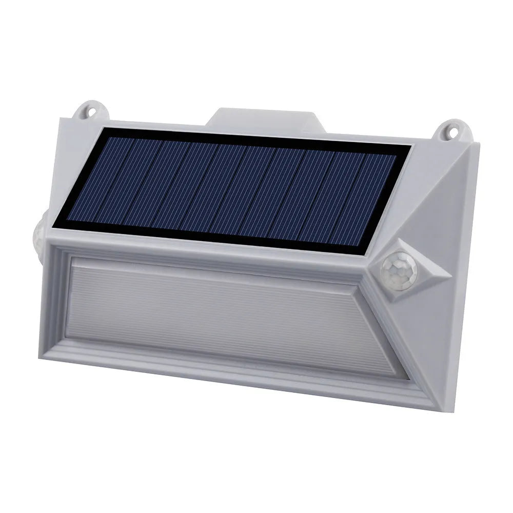 Solar-powered outdoor step light with motion sensor in abstract design for mounting on walls or steps.