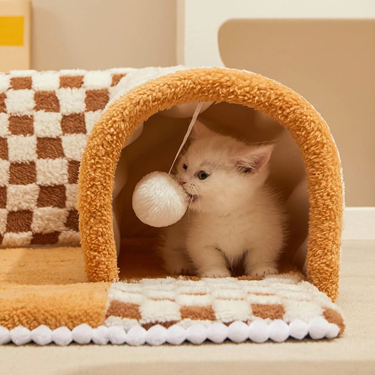 Fan shaped plush pet bed with integrated tunnel in plaid design, shown in coffee colour.