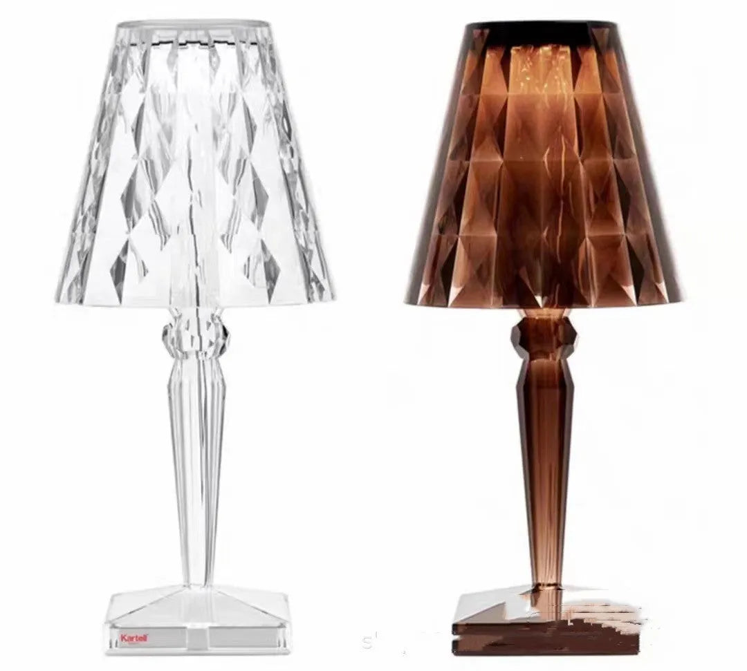 Rose gold portable touch projection night light with dimming controls on acrylic base.