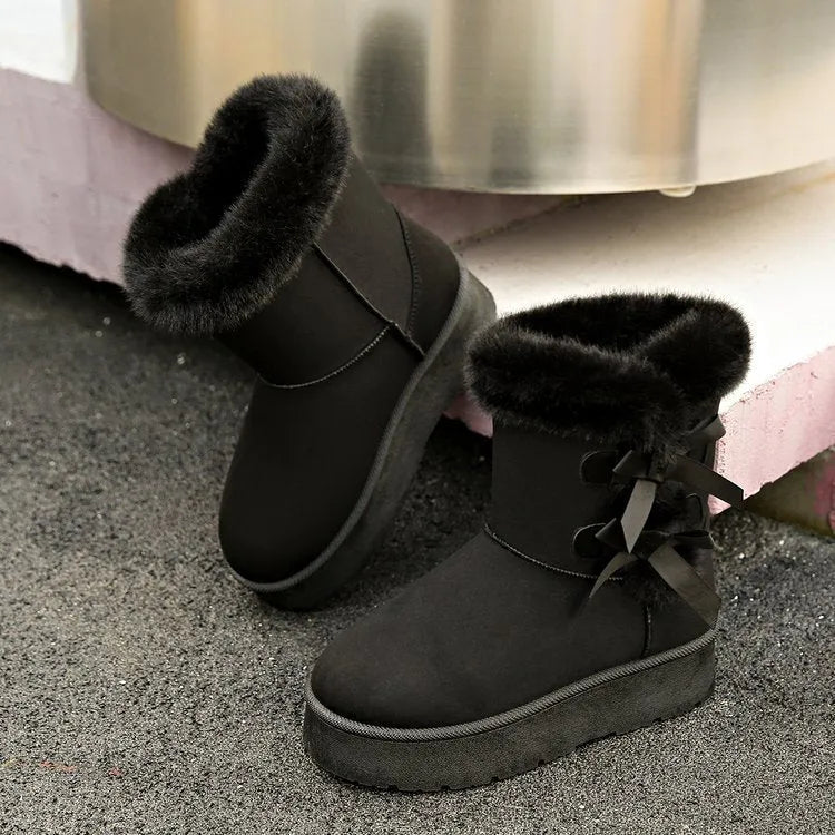 Women's black suede fleece lined ankle boots with bow, side view showing high-top shaft