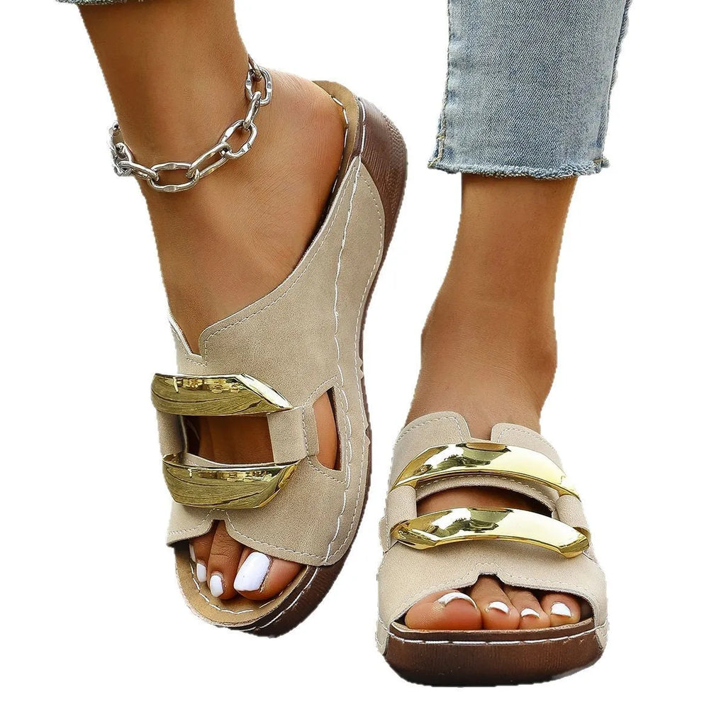 Roman style platform flip-flop sandals in a solid colour with a flat heel and metal detail.