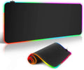Symphony RGB luminous gaming mouse pad with starry sky pattern on a desk, showing USB cable.