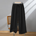 Women's straight-leg casual trousers in apricot colour with an elastic waistband and lace-up drawstring detail.