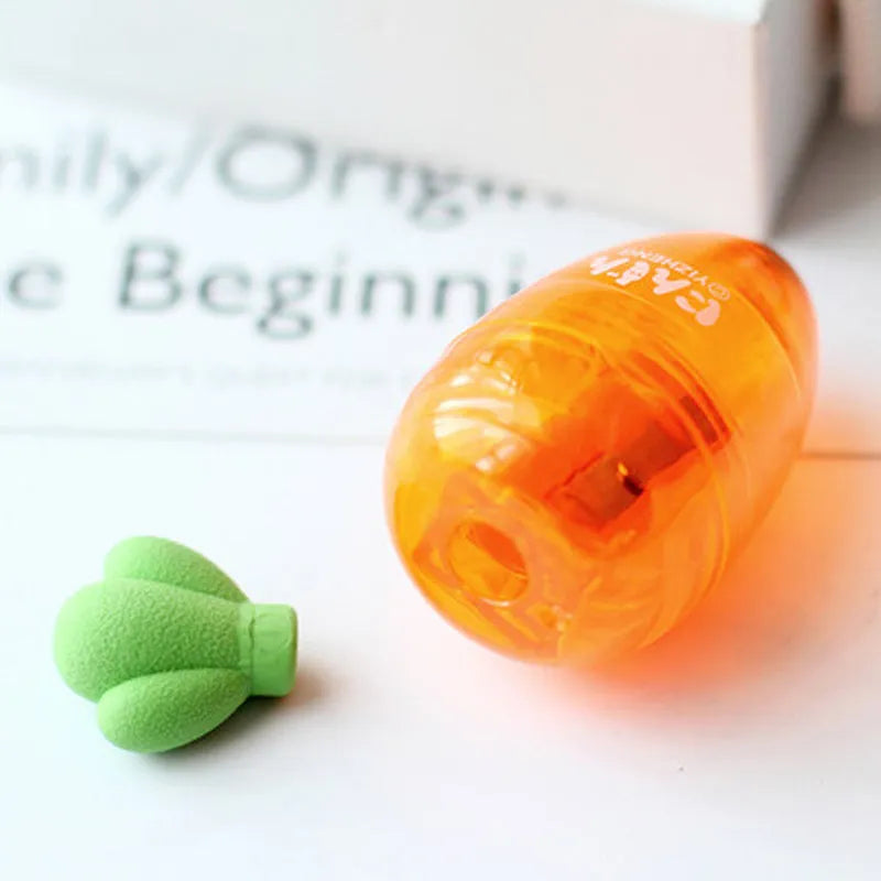 Orange plastic carrot cartoon pencil sharpener on a white background.
