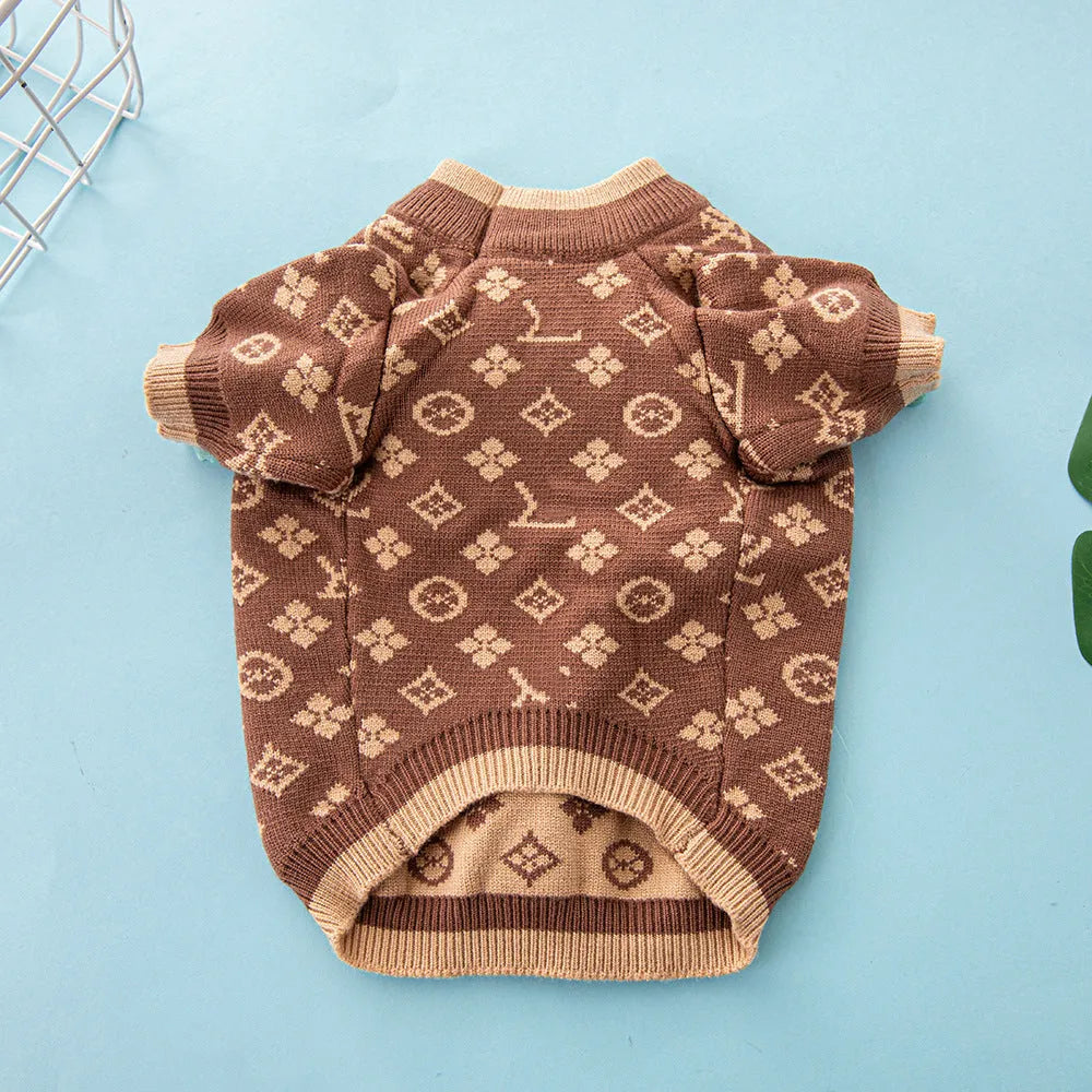 A thick knitted wool dog sweater shown in a two-tone colour, sized for a small breed.