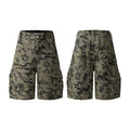 Retro loose-fit washed cotton shorts in camouflage colour on a neutral background.
