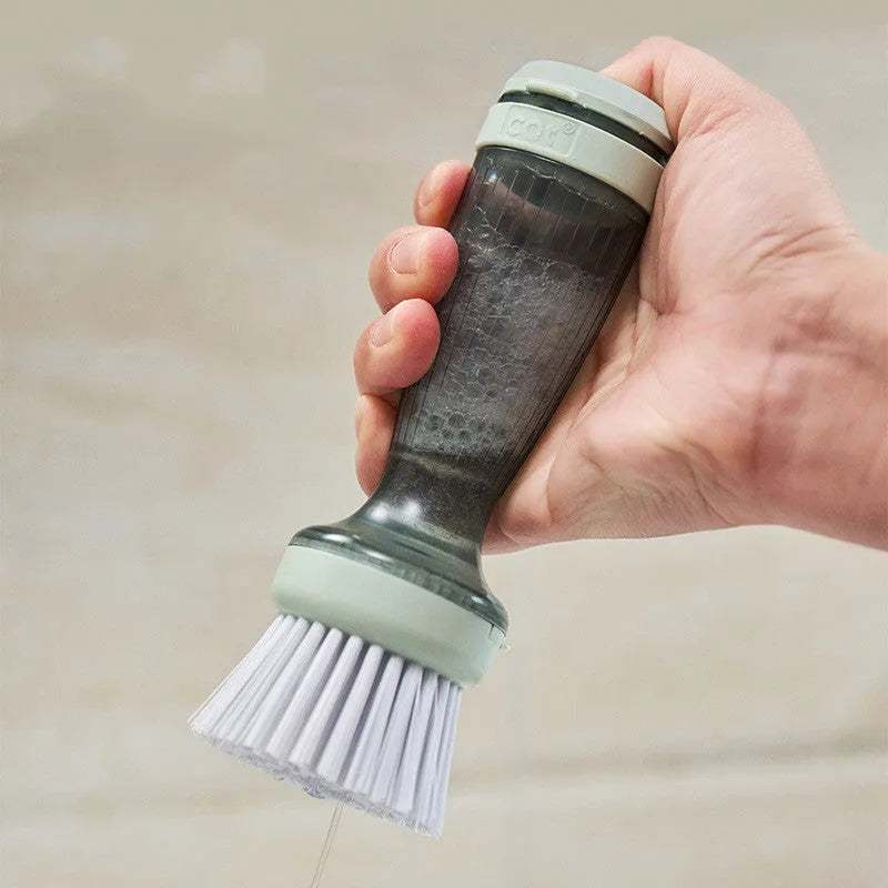 Milk white and mint green pot brush with integrated soap dispenser and replaceable head.