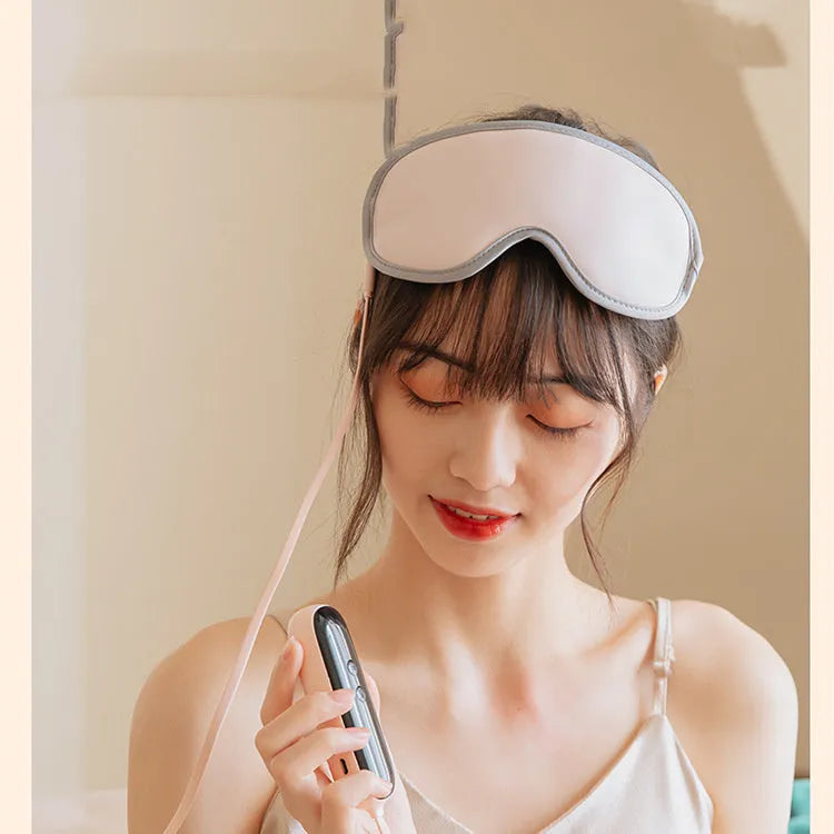 Portable eye SPA massage goggles in pink or green with steam and vibration functions