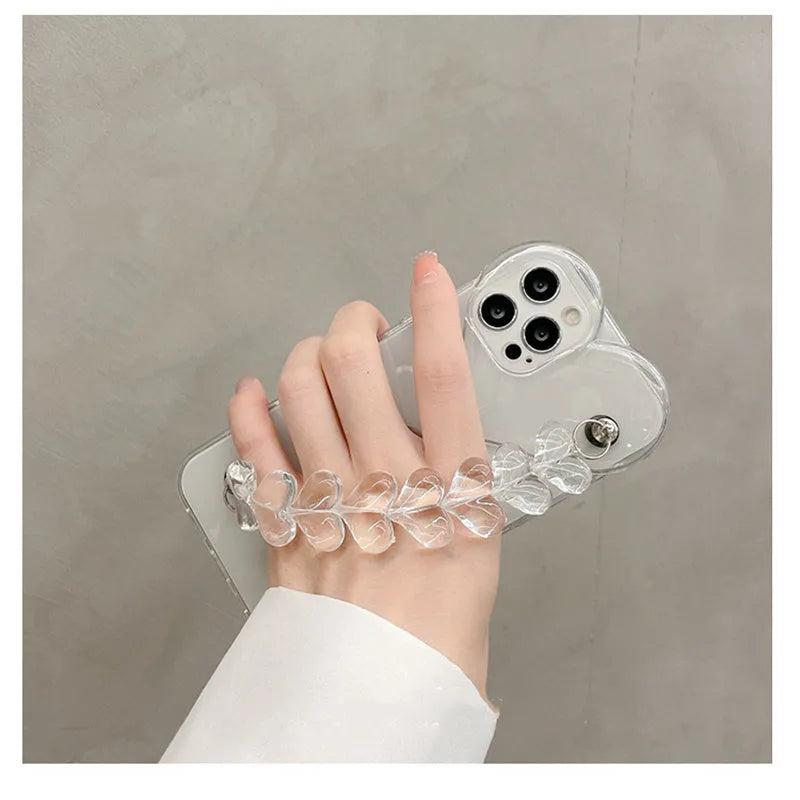 Transparent soft TPU iPhone case with a decorative silver love bracelet chain attached.