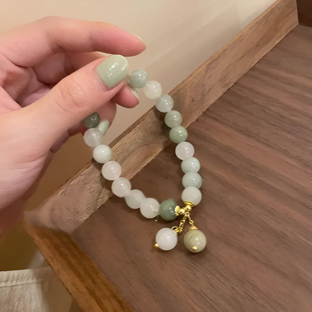 Women's white multi-layer beaded bracelet with rice-shaped and round beads in ethnic vintage style.