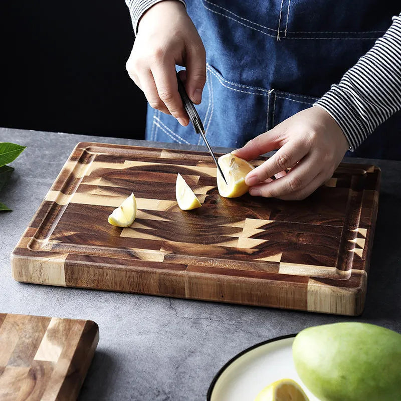 Brown solid wood cutting board with parquet pattern, 3cm thick, on kitchen counter