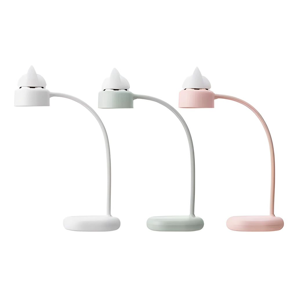 White clip-on LED desk lamp with adjustable arm on desk edge